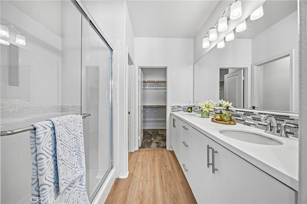11175 Legion Loop, Unit 110 El Monte, CA 91731 - Photo 16 of 23 a bathroom with a sink and a mirror