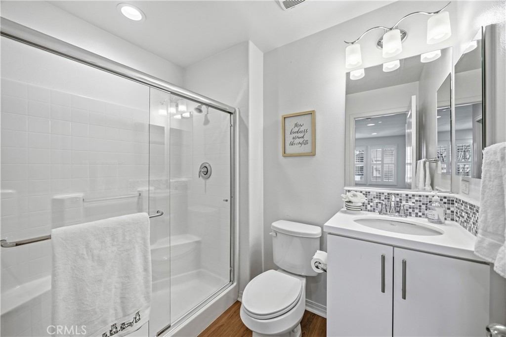 11175 Legion Loop, Unit 110 El Monte, CA 91731 - Photo 18 of 23 a bathroom with a sink toilet a mirror and shower