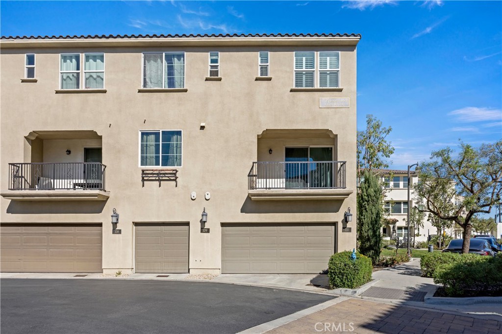 11175 Legion Loop, Unit 110 El Monte, CA 91731 - Photo 3 of 23 a front view of a house with a yard