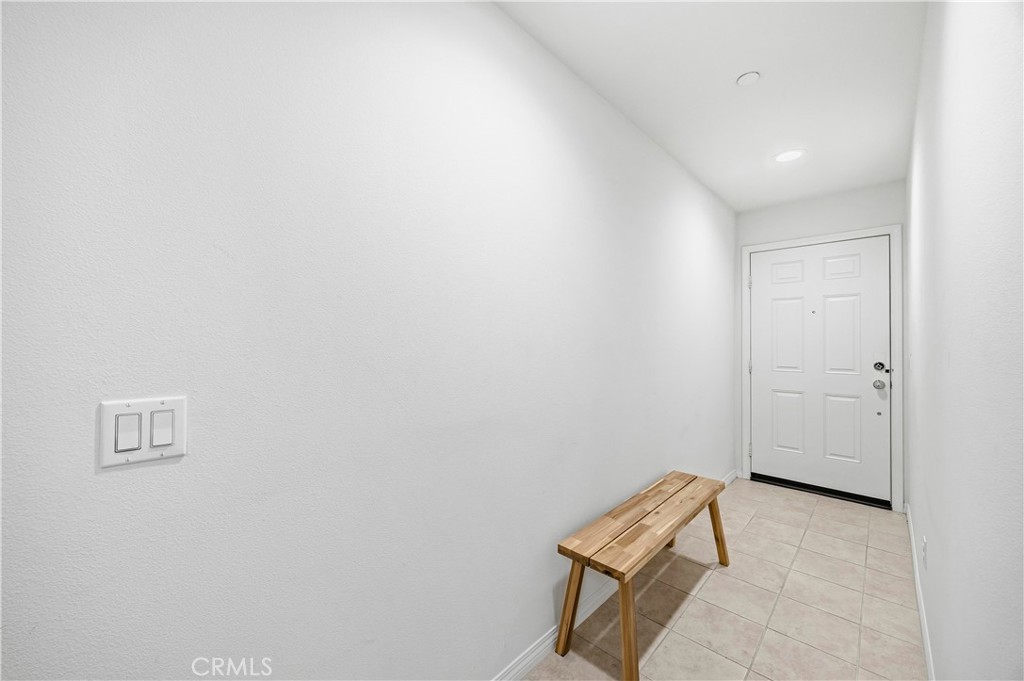 11175 Legion Loop, Unit 110 El Monte, CA 91731 - Photo 4 of 23 a room with a bench