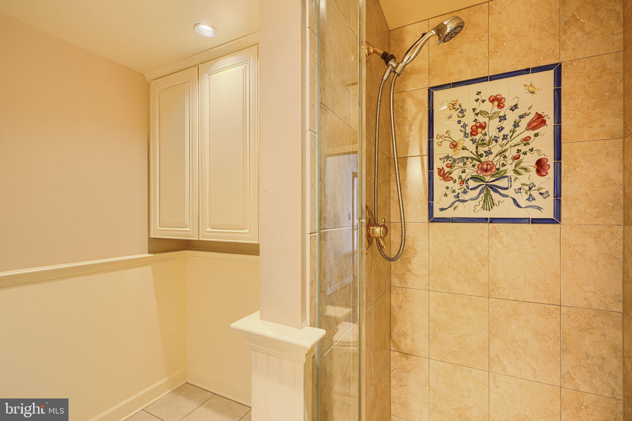 1000 Fell Street, Unit 606 Baltimore, MD 21231 - Photo 35 of 56 Elegant shower with floral tile art.