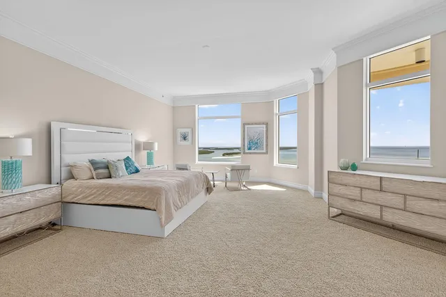 a view of a room that has a bed and a window