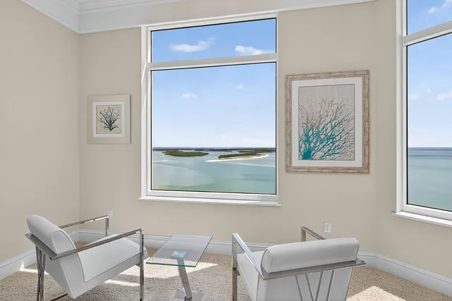 a spacious bedroom with a bed and a large window