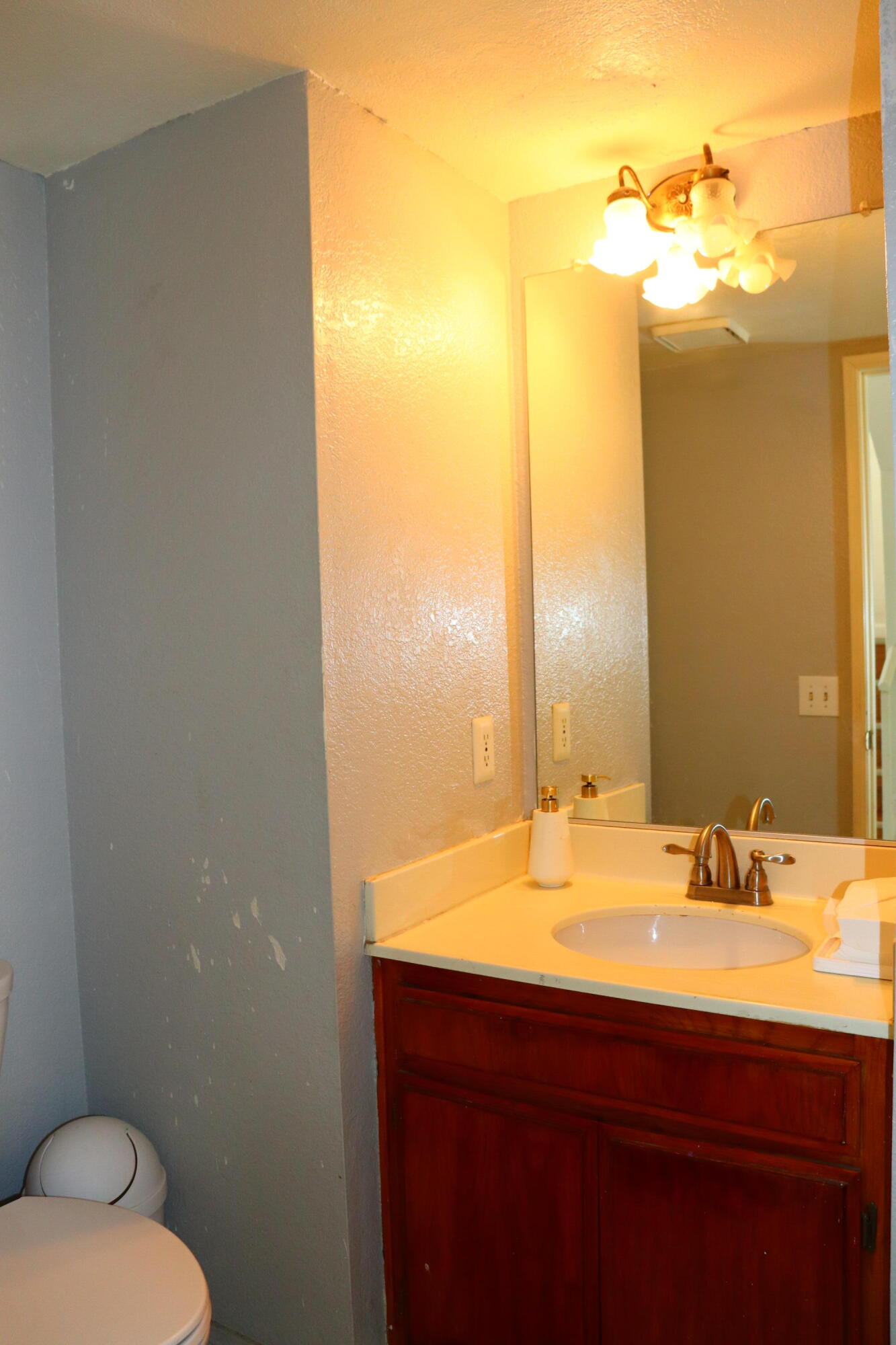5009 East Ave R 11 Palmdale, CA 93552 - Photo 12 of 23 a bathroom with a sink and a mirror