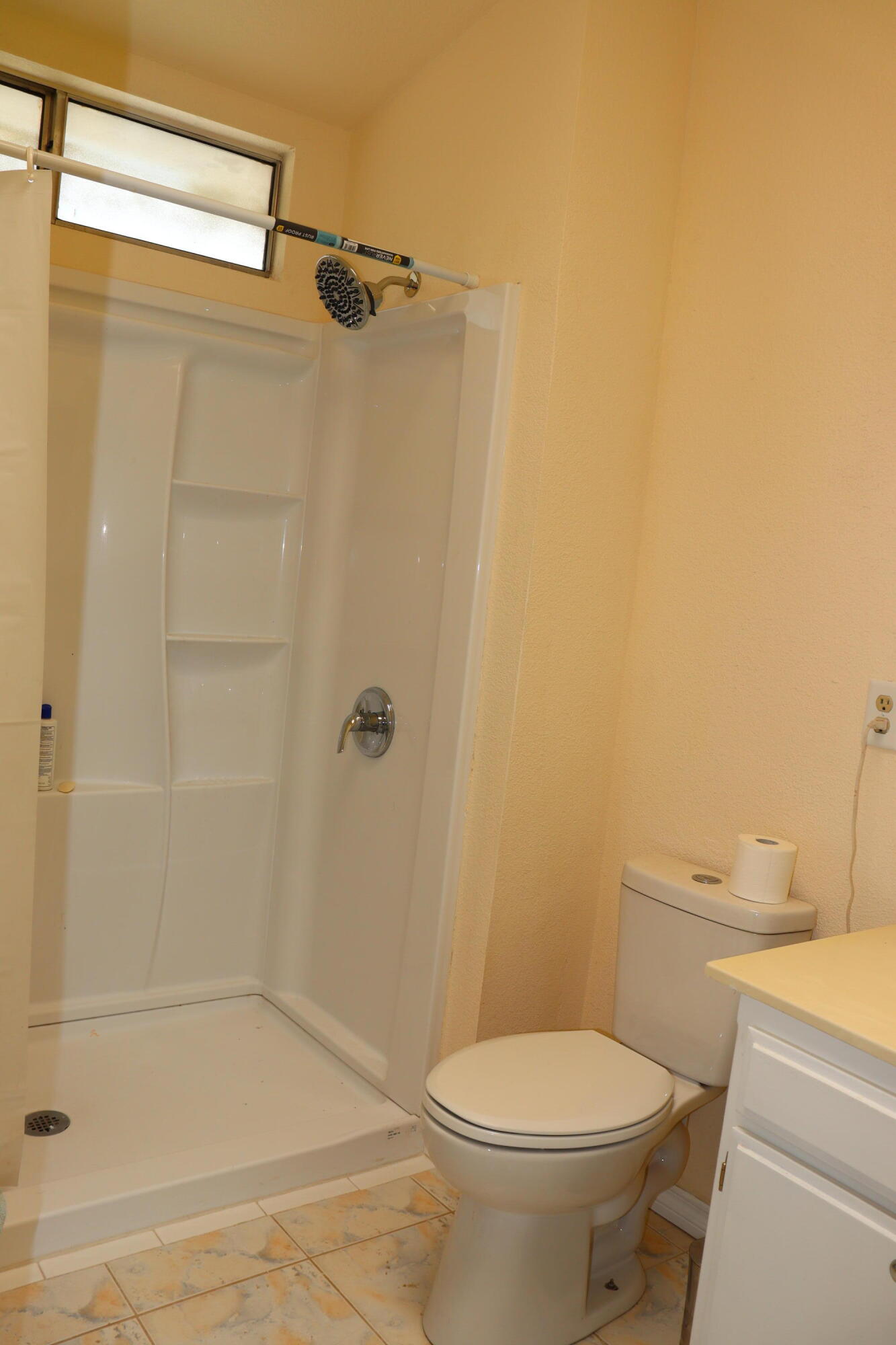 5009 East Ave R 11 Palmdale, CA 93552 - Photo 18 of 23 a bathroom with a toilet and shower