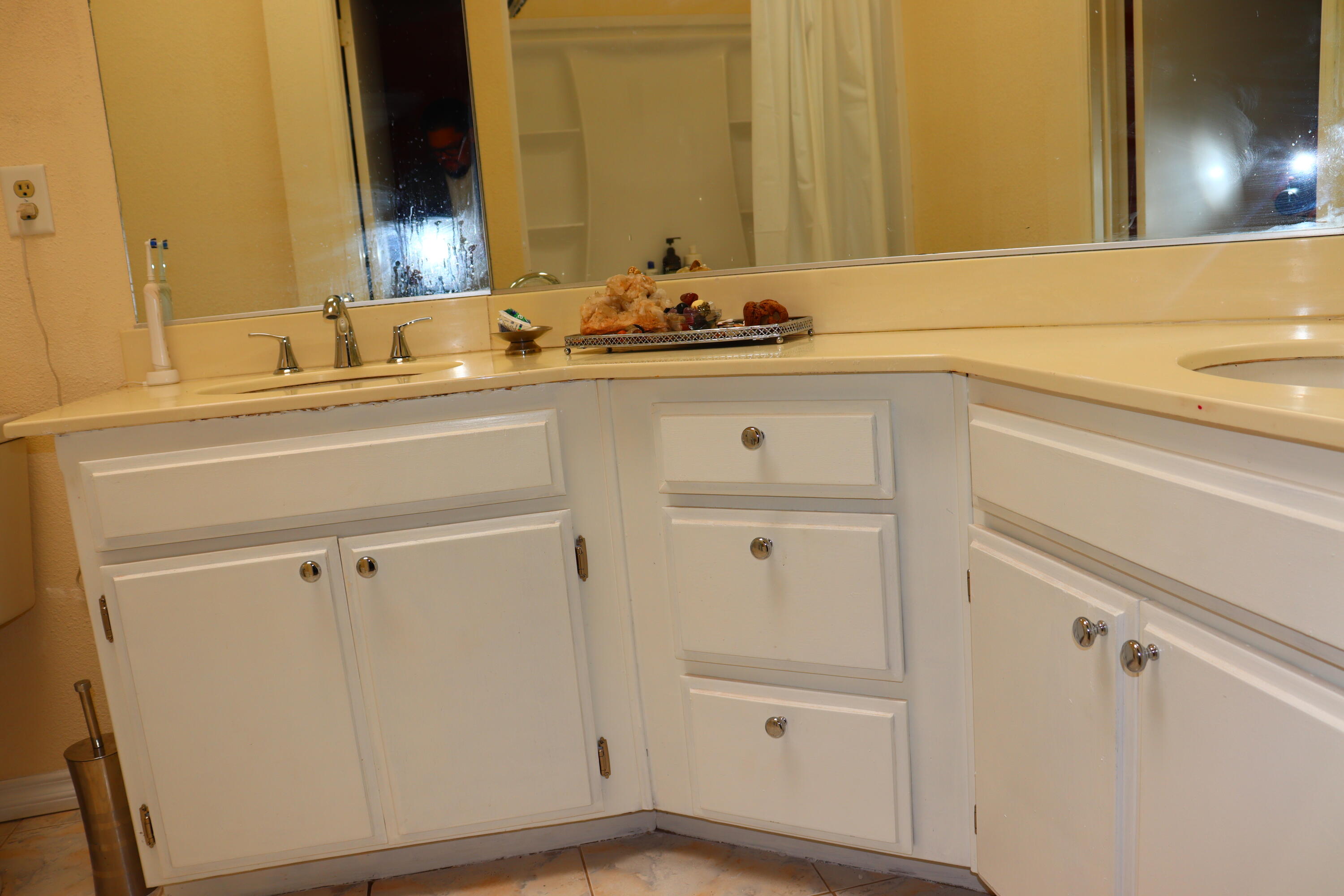 5009 East Ave R 11 Palmdale, CA 93552 - Photo 20 of 23 a bathroom with a sink and a mirror