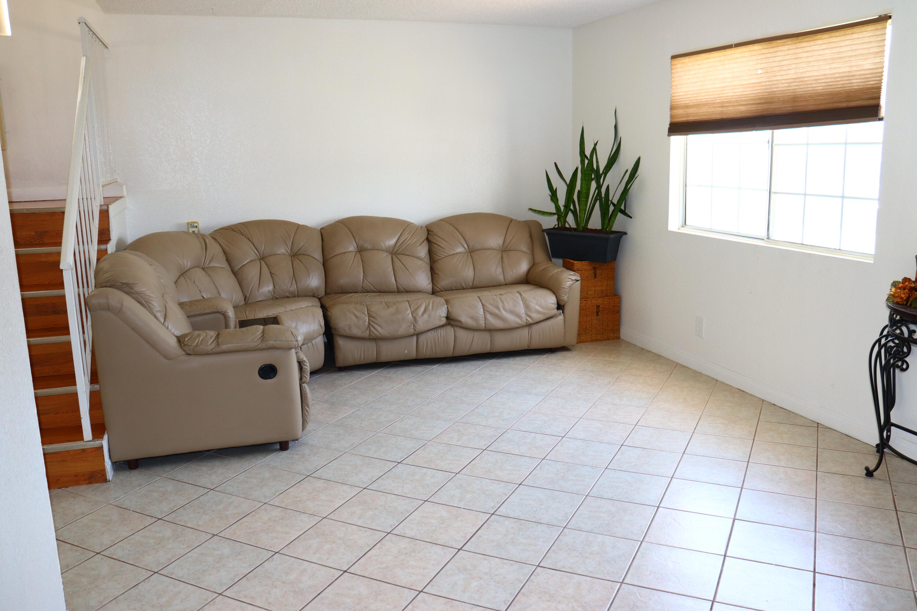 5009 East Ave R 11 Palmdale, CA 93552 - Photo 3 of 23 a living room with furniture and a window