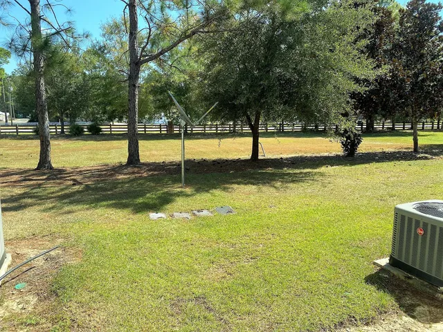 a view of a swimming pool with an outdoor seating