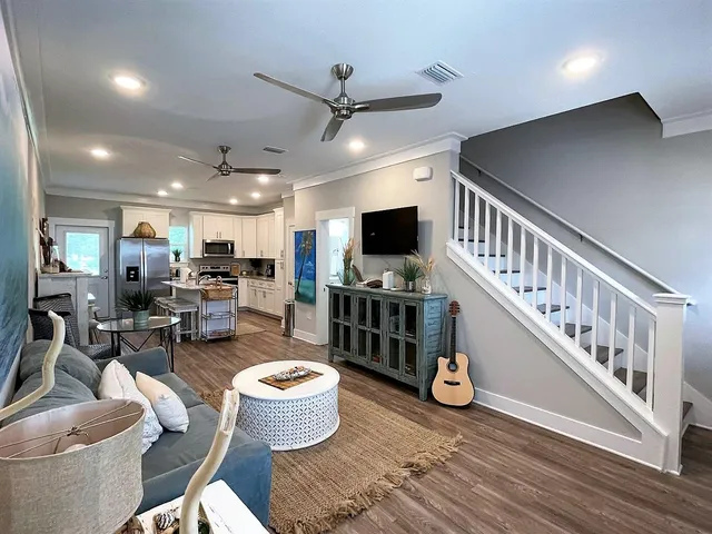 a living room with furniture and a flat screen tv