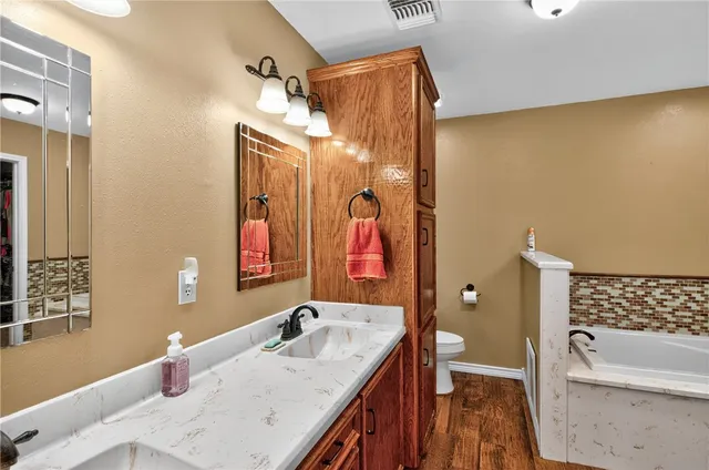 a bathroom with a bathtub and a sink