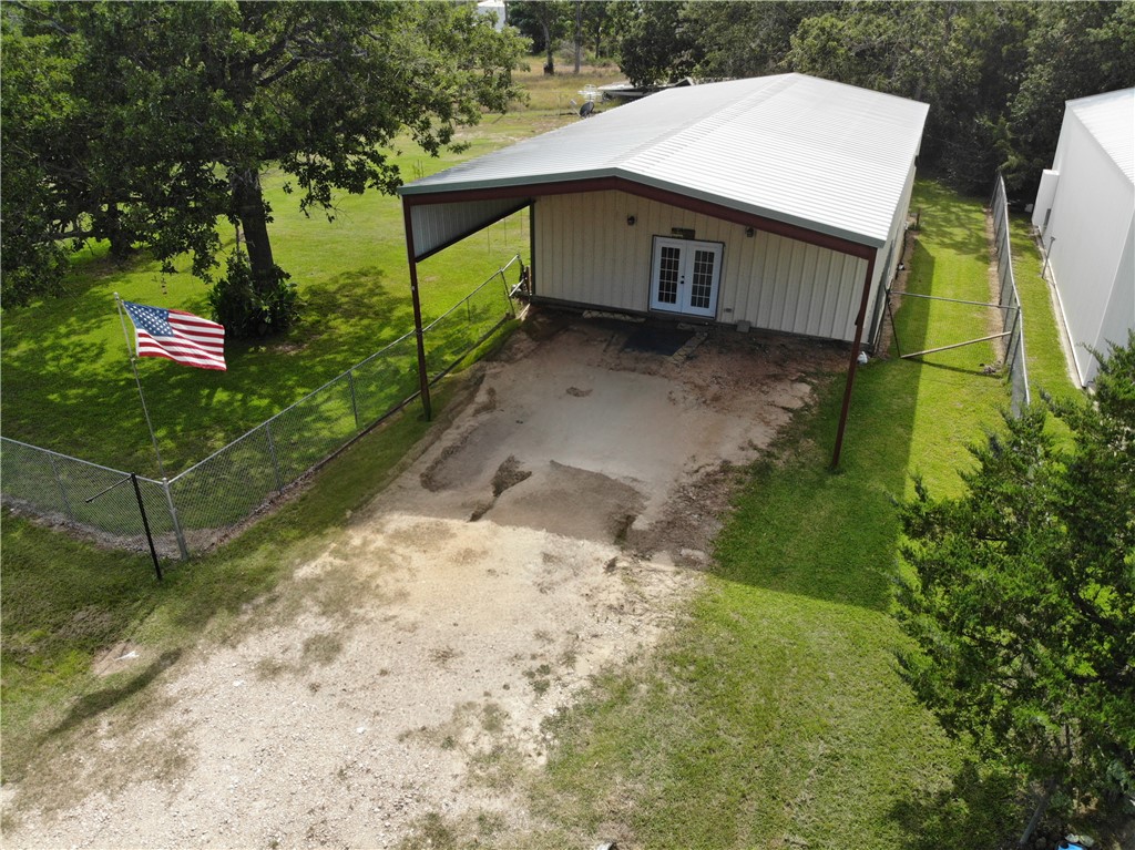 409 Ripple Creek Lane Somerville, TX 77879 - Photo 2 of 33 a view of a house with a yard