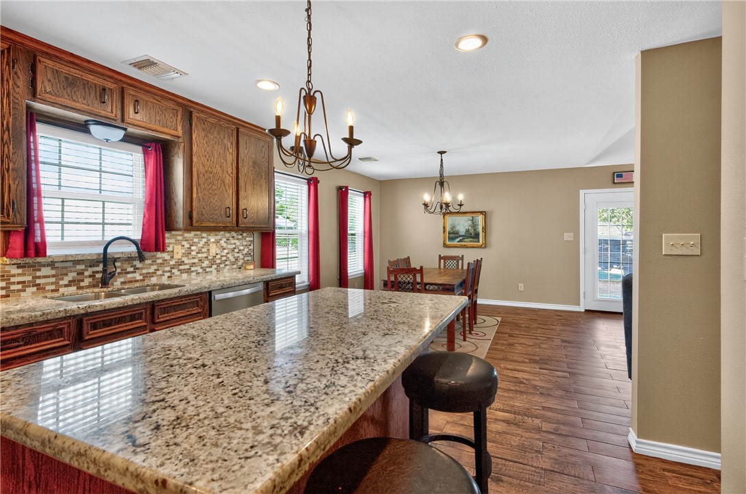 409 Ripple Creek Lane Somerville, TX 77879 - Photo 26 of 33 a kitchen with stainless steel appliances granite countertop a stove and refrigerator