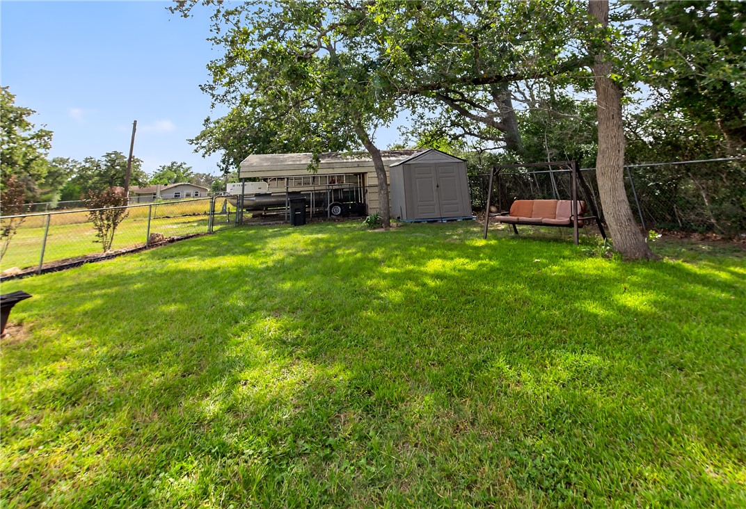 409 Ripple Creek Lane Somerville, TX 77879 - Photo 29 of 33 a front view of a house with garden and trees