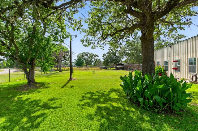 a view of backyard with green space