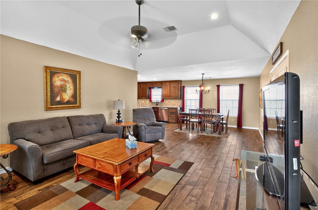 409 Ripple Creek Lane Somerville, TX 77879 - Photo 8 of 33 a living room with furniture a flat screen tv and a table