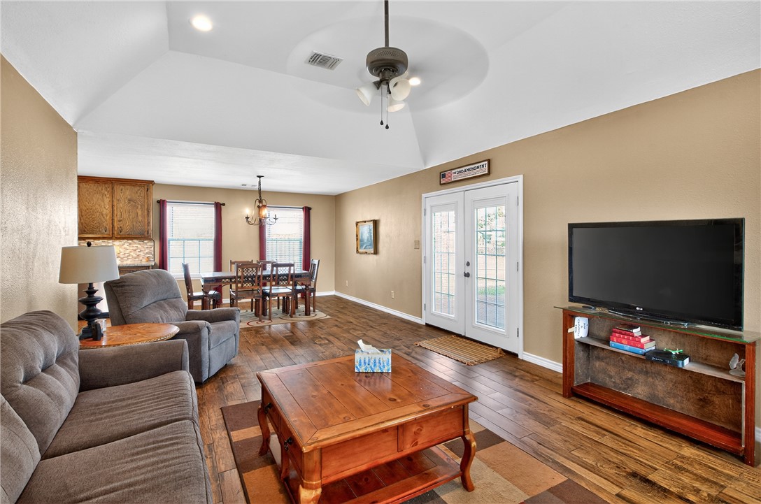 409 Ripple Creek Lane Somerville, TX 77879 - Photo 9 of 33 a living room with furniture and a flat screen tv