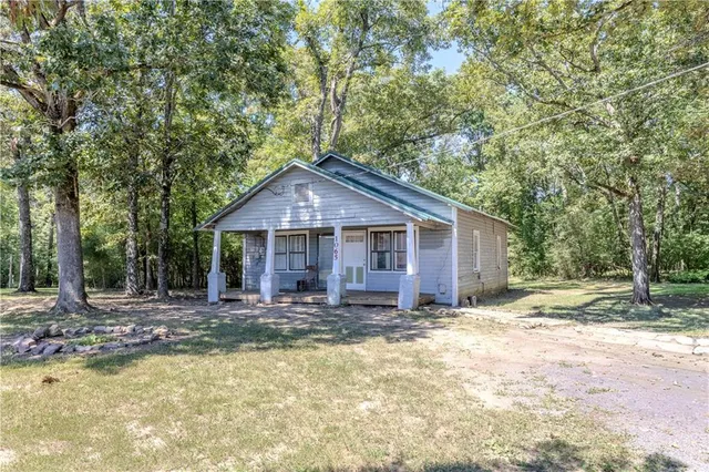 a view of outdoor space with trees all around