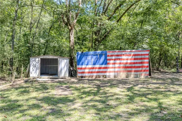 a view of a small house in forest