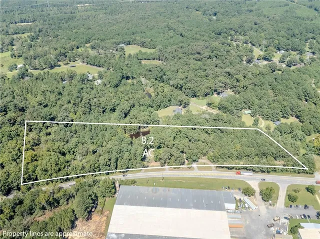 a view of a yard with a wooden deck