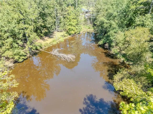 a view of a lake with a yard
