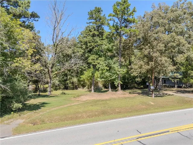 a view of a swimming pool with a lake and mountain view
