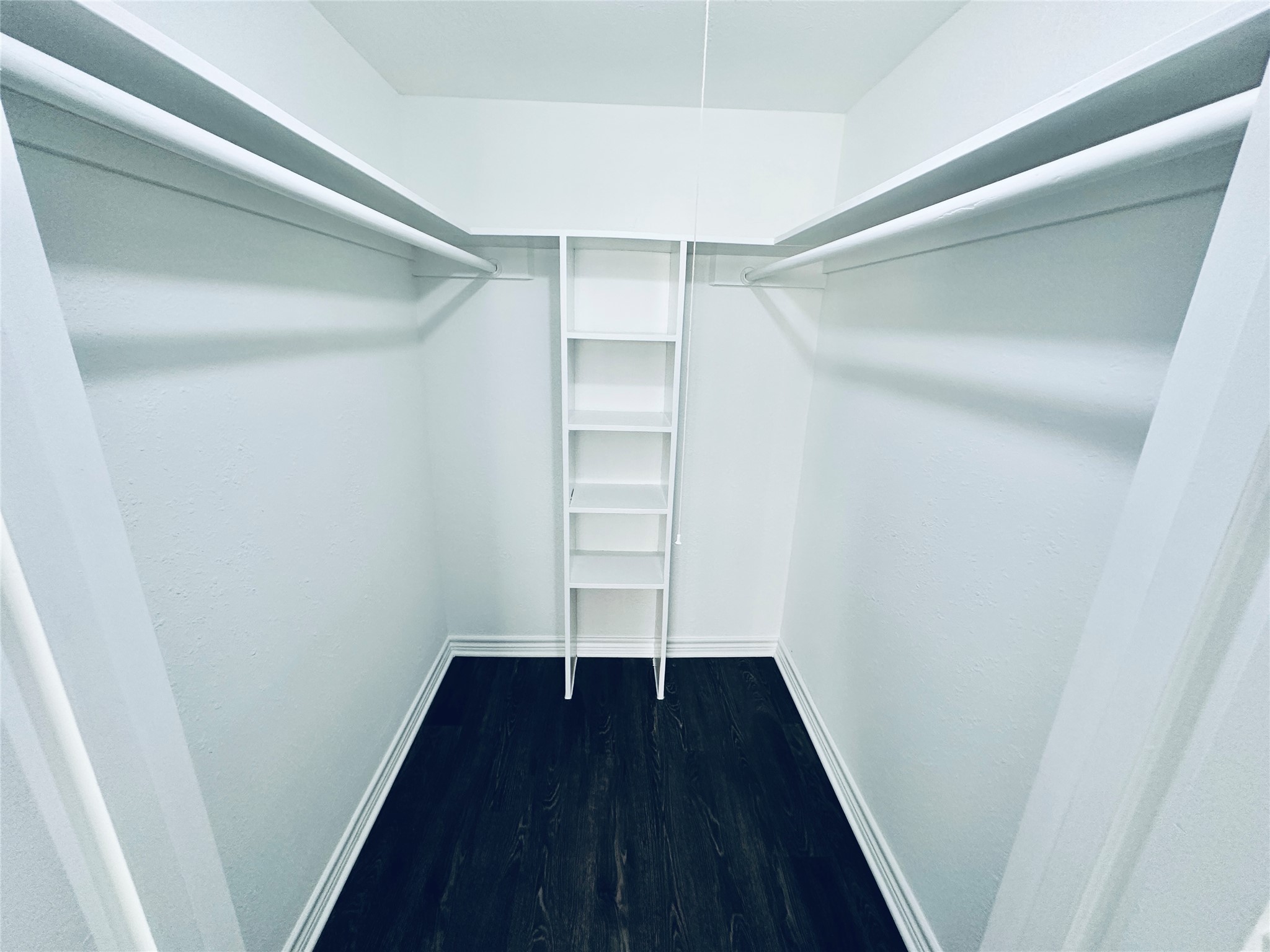 601 West 11th Street, Unit 121 Austin, TX 78701 - Photo 3 of 7 a view of walk in closet with wooden floor