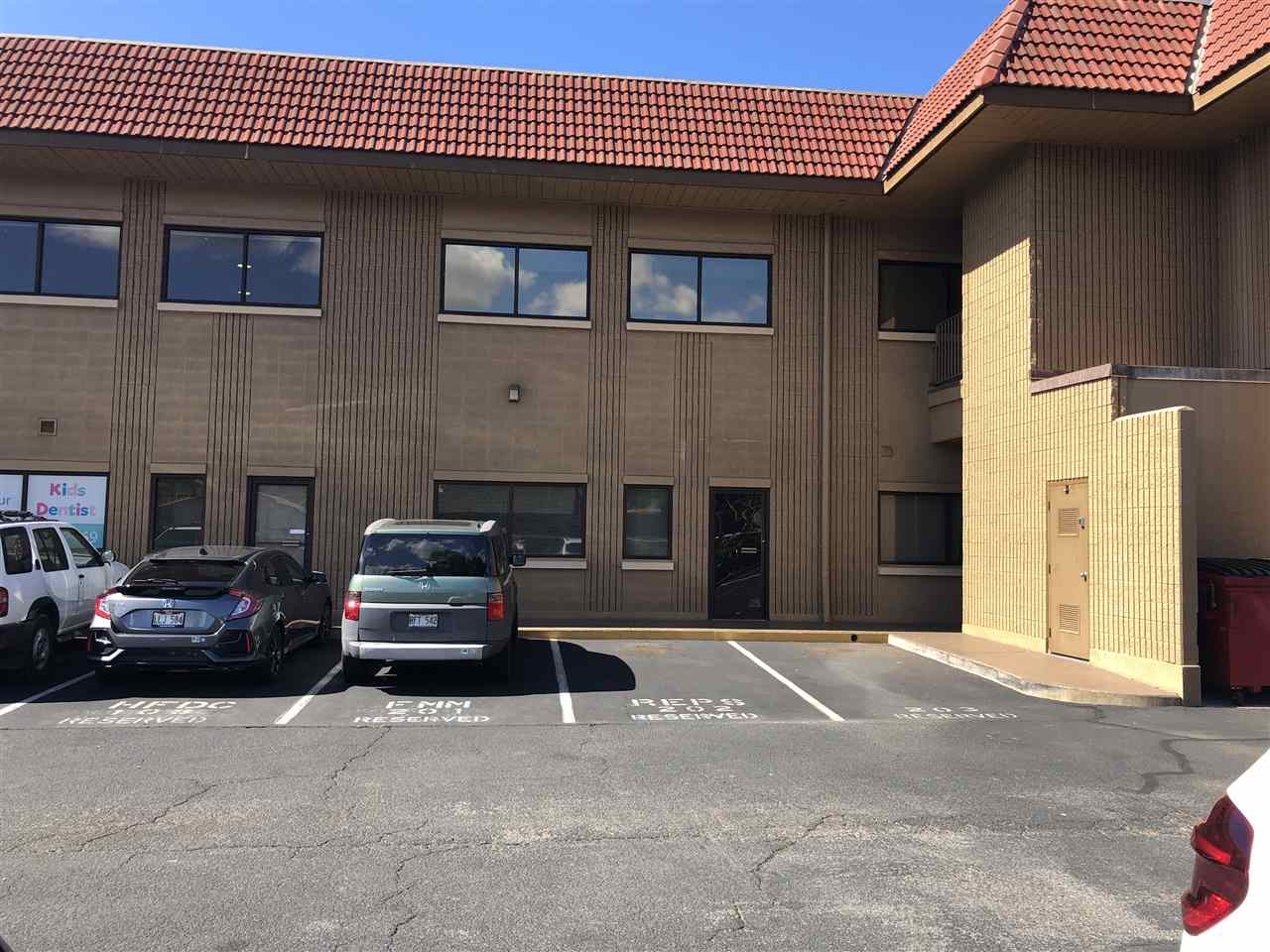 1847 South Kihei Road, Unit 106 Kihei, HI 96753 - Photo 1 of 3 a car parked in front of a building