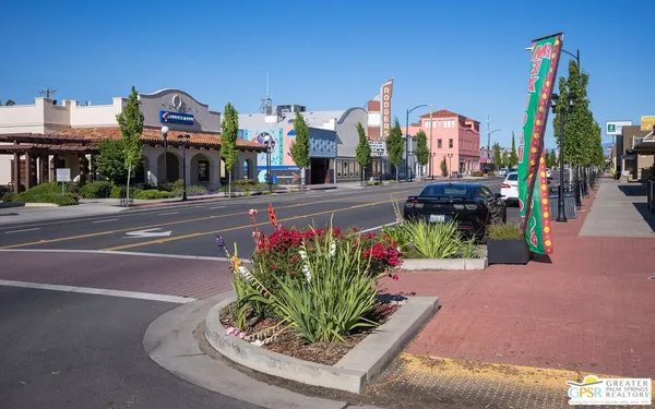 a front view of a building with sitting area