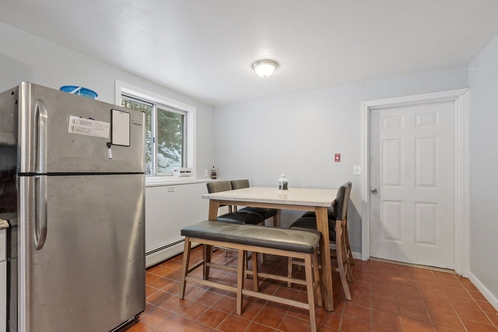 60 Stone Valley Road Orange, MA 01364 - Photo 12 of 27 a dining room with a table and chairs
