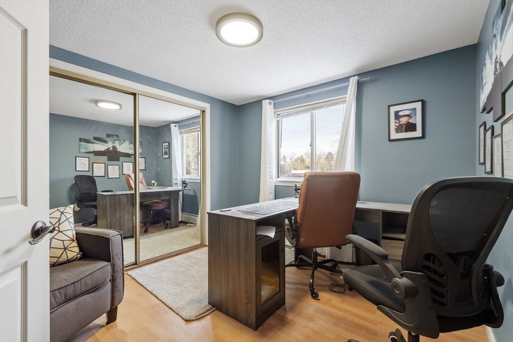 60 Stone Valley Road Orange, MA 01364 - Photo 18 of 27 a view of a livingroom with workspace and a couch