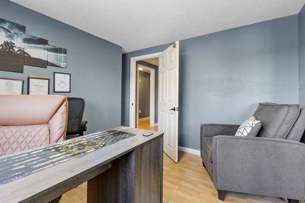 60 Stone Valley Road Orange, MA 01364 - Photo 19 of 27 a living room with a couch and a dresser