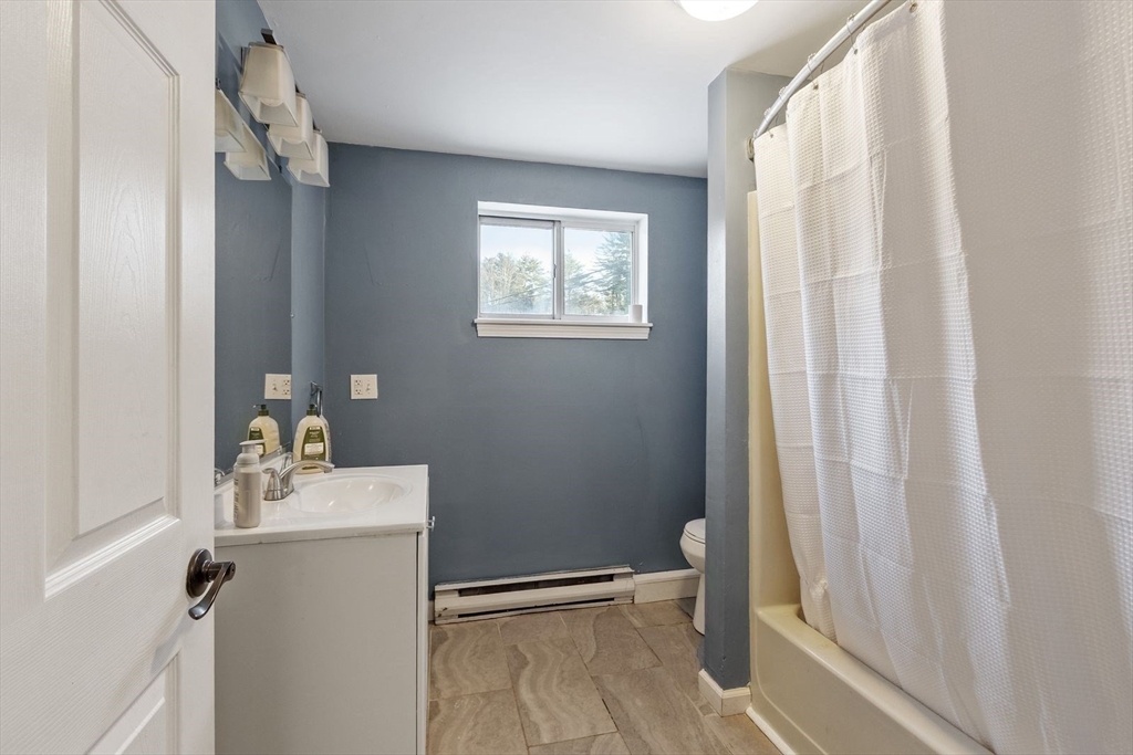60 Stone Valley Road Orange, MA 01364 - Photo 25 of 27 a bathroom with a sink toilet and shower