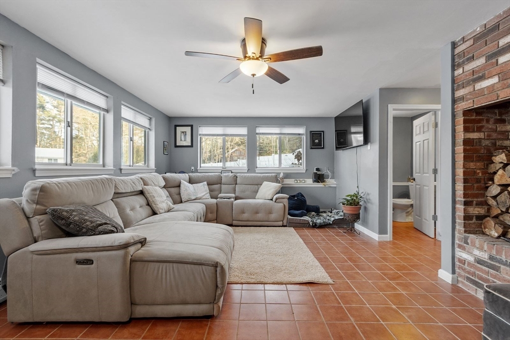 60 Stone Valley Road Orange, MA 01364 - Photo 3 of 27 a living room with furniture and a large window