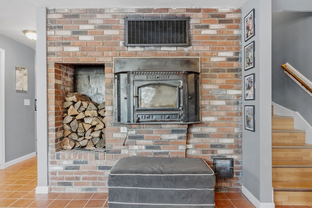 60 Stone Valley Road Orange, MA 01364 - Photo 6 of 27 a living room with fireplace