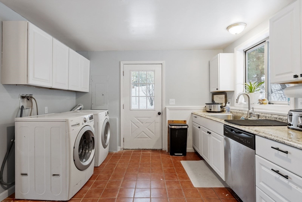 60 Stone Valley Road Orange, MA 01364 - Photo 8 of 27 a kitchen with stainless steel appliances granite countertop a white stove top oven sink and cabinets