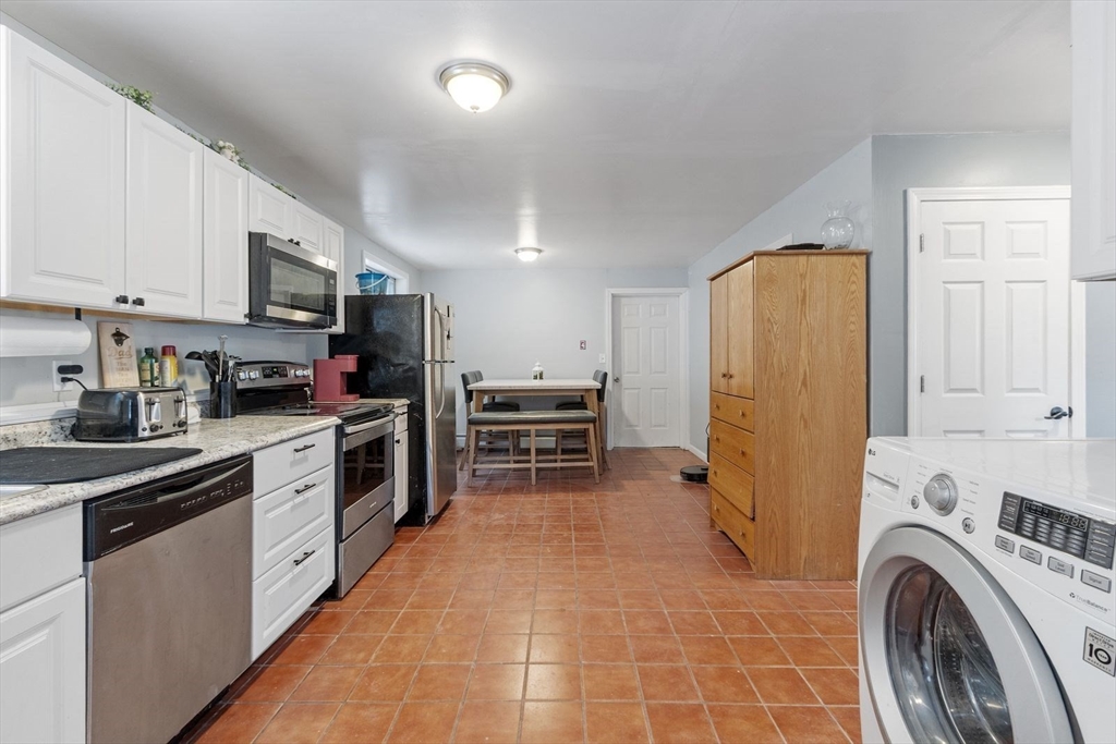 60 Stone Valley Road Orange, MA 01364 - Photo 10 of 27 a kitchen with refrigerator and cabinets