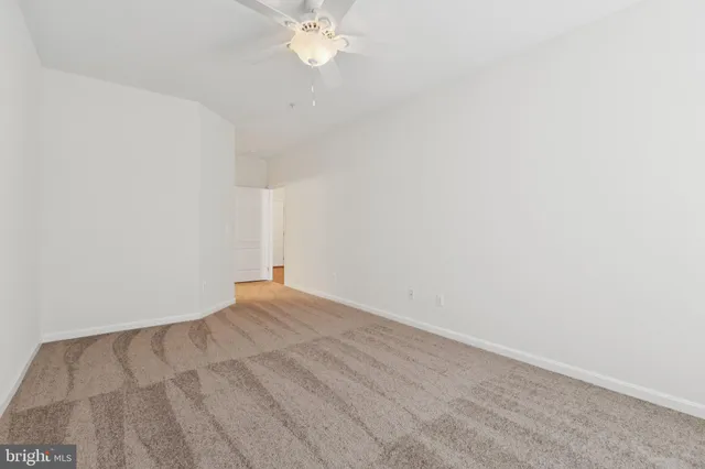 an aerial view of a swimming pool a yard and outdoor seating