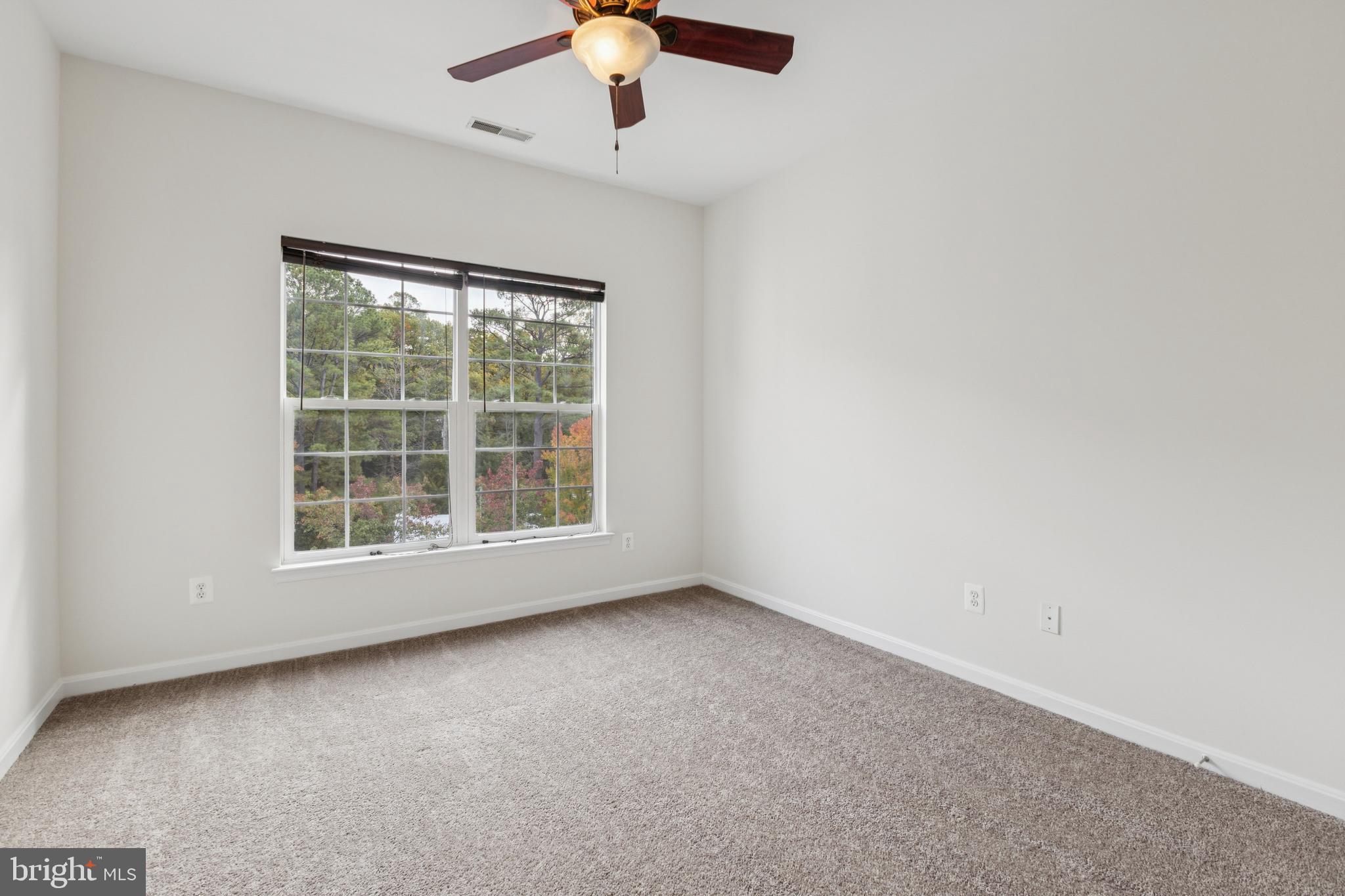 1371 Schooner Loop, Unit 1371 Solomons, MD 20688 - Photo 26 of 38 an empty room with a window