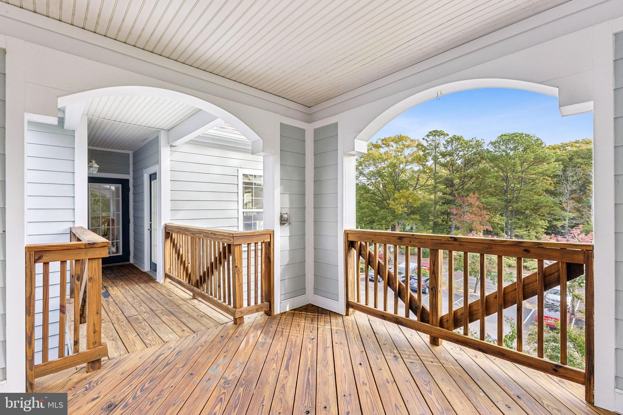 1371 Schooner Loop, Unit 1371 Solomons, MD 20688 - Photo 4 of 38 a view of balcony with wooden floor