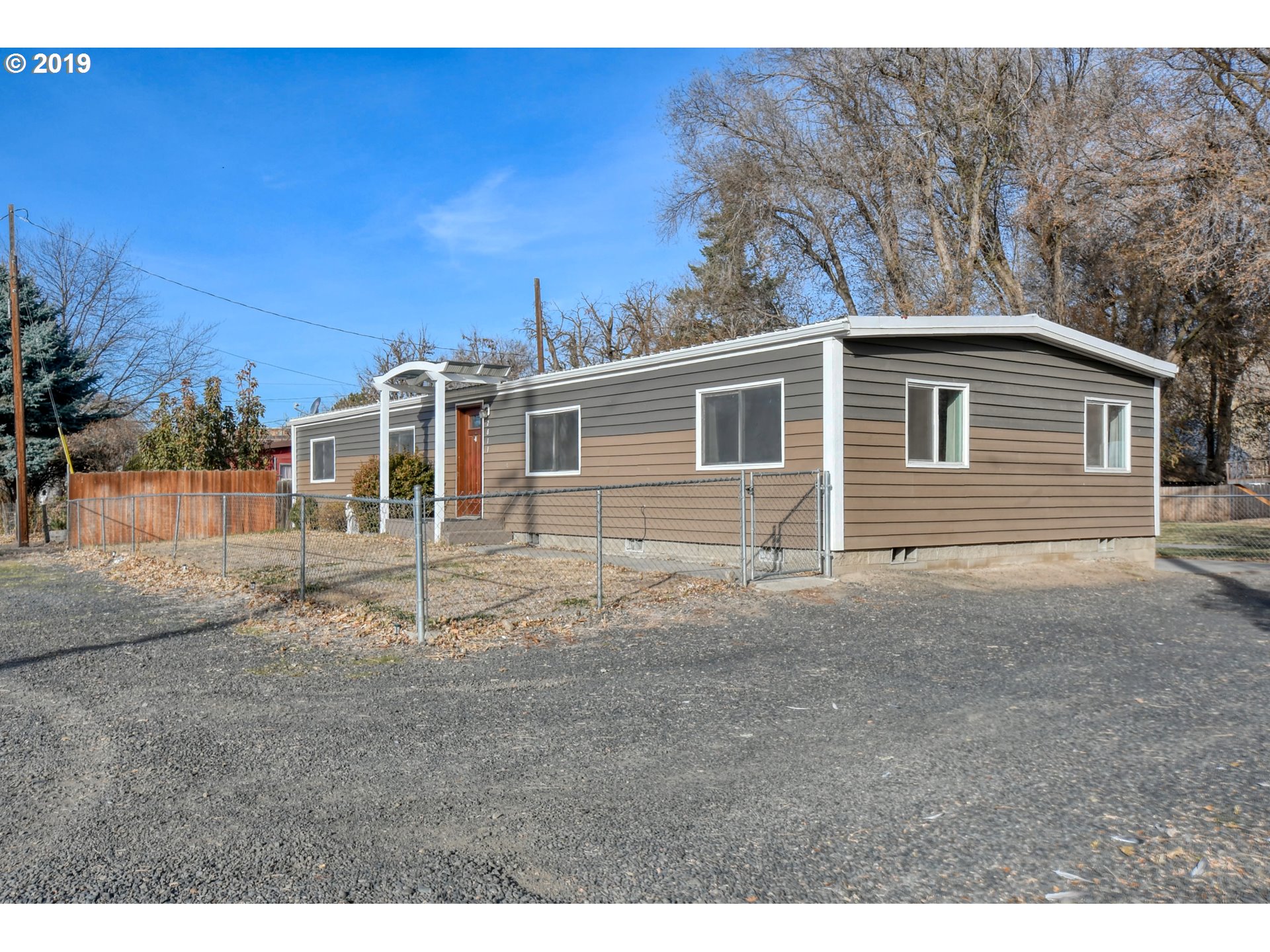 2811 Northeast Riverside Avenue Pendleton, OR 97801 - Photo 2 of 32 a view of a house with a backyard