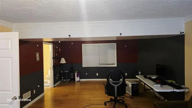 a view of workspace with wooden floor