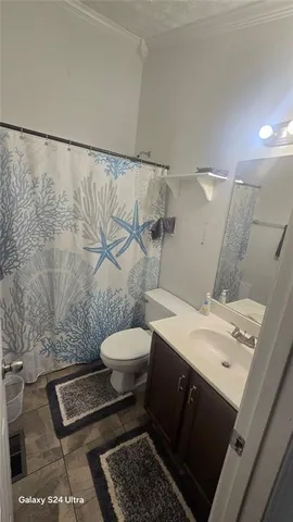 a bathroom with a sink and a toilet