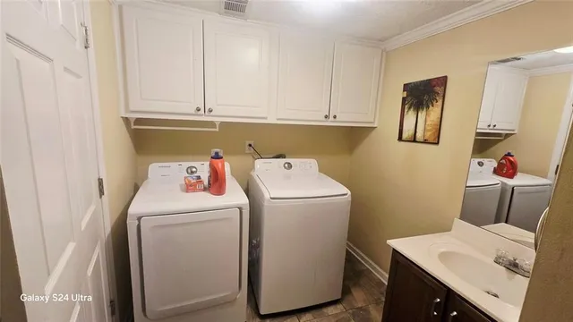 a utility room with dryer and washer