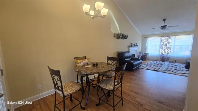 a view of a dining room with furniture and window