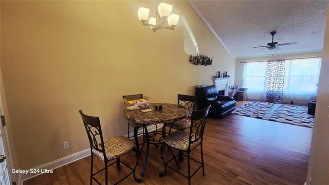 a view of a dining room with furniture and window