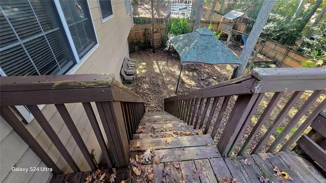 a view of stairs and wooden floor