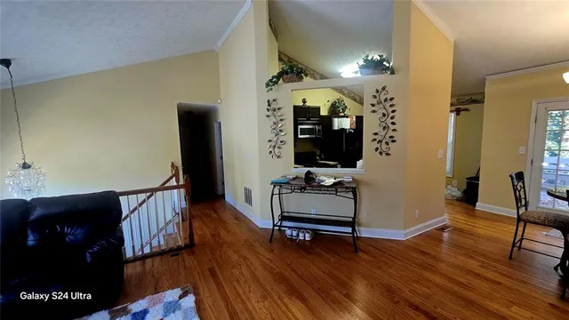 a view of a livingroom with furniture and wooden floor