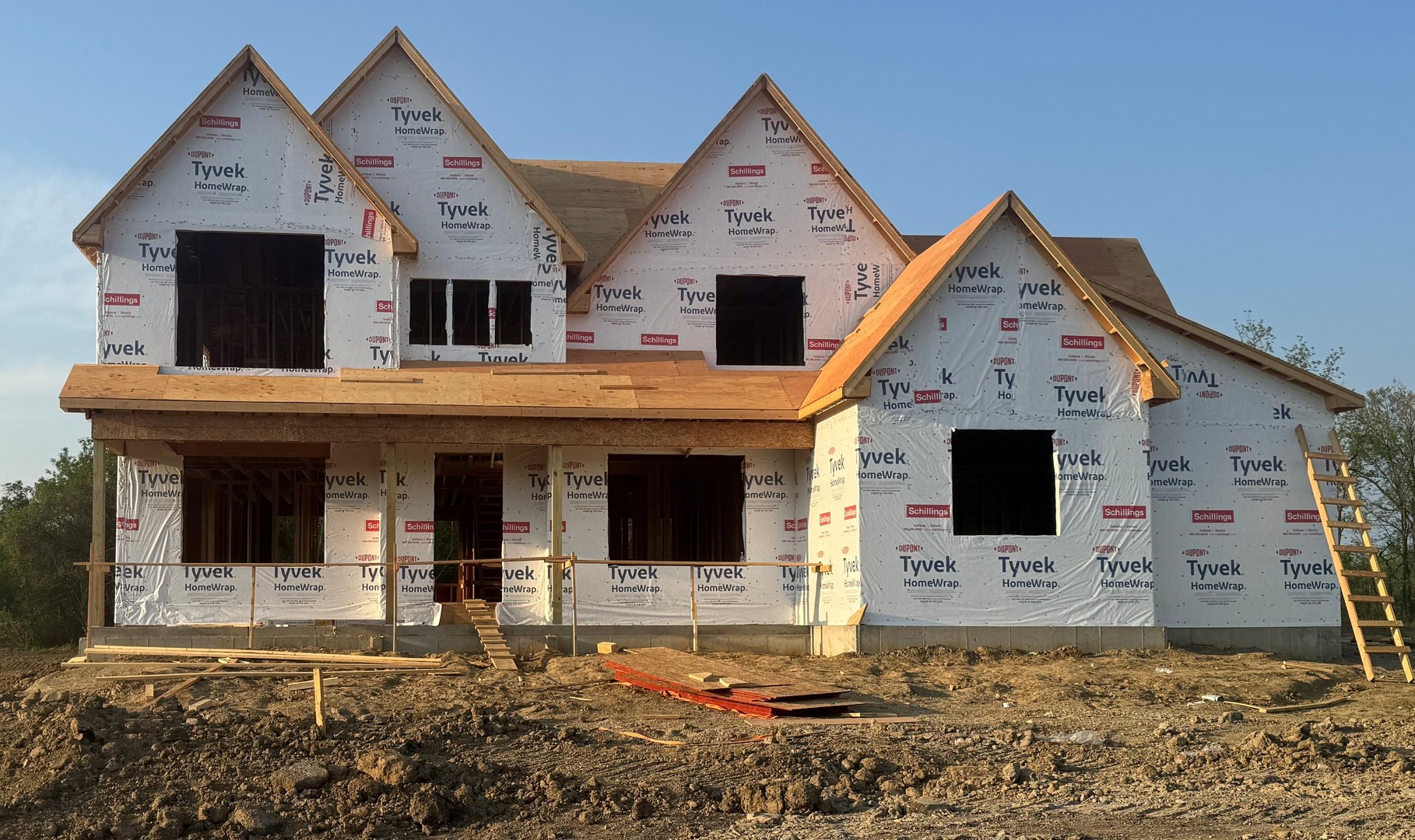 a view of a white house with large windows