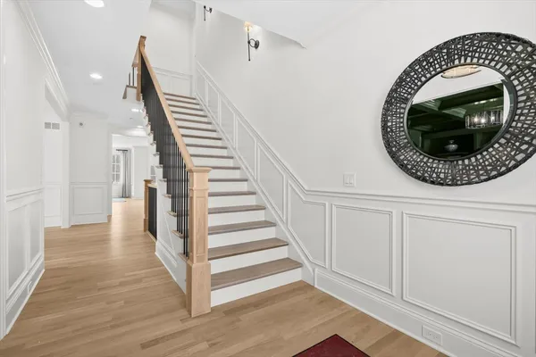 a view of a livingroom with wooden floor and white walls
