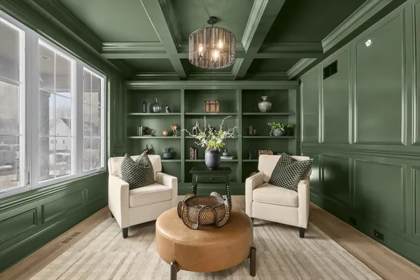 a living room with furniture and a chandelier